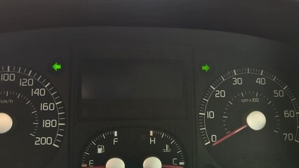 Flashing arrows on the dashboard of the car. Alarm signal on the instrument panel