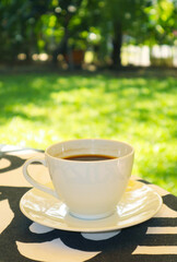 Cup of fresh brewed aromatic hot coffee on the table