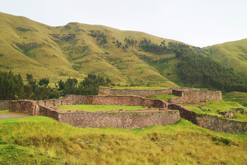 Fototapeta na wymiar Puka Pukara Red Fortress, the remains of Inca fortress built from deep red color stone, located on the hilltop of Cusco region, Peru, South America
