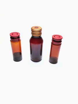 group of various sizes of brown medicine bottles isolated on white background, clipping path.