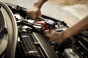 Mechanic open vehicle hood checking up auto mobile, fixing a car at home,Repair and service