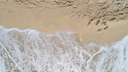 sea ocean wave coming on sandy beach view from top