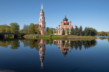 Ancient Resurrection Cathedral with reflection on a warm May morning. Staraya Russa, Russia