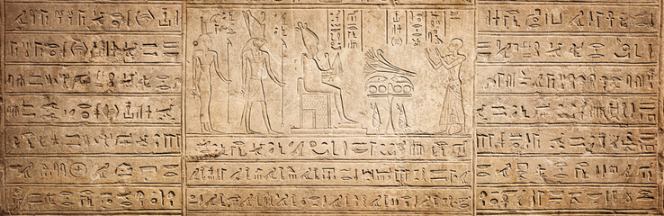 Old Egyptian hieroglyphs on an ancient background. Wide historical background. Ancient Egyptian hieroglyphs as a symbol of the history of the Earth. - 601812522