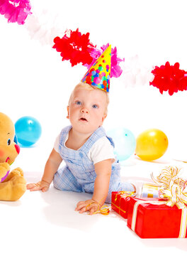 Astonished baby boy at the birthday party