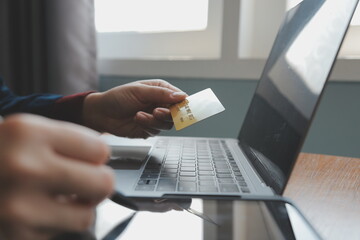 Women holding credit card and using smartphones at home.Online shopping, internet banking, store online, payment, spending money, e-commerce payment at the store, credit card, concept