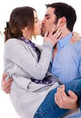 Romantic couple kissing each other on a white background