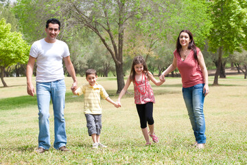 Family posing to camera in the park,outdoor