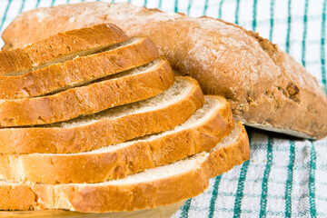 Sliced white bread on a tea cloth