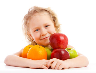 Fototapeta na wymiar Lovely preschool girl with a fruit heap