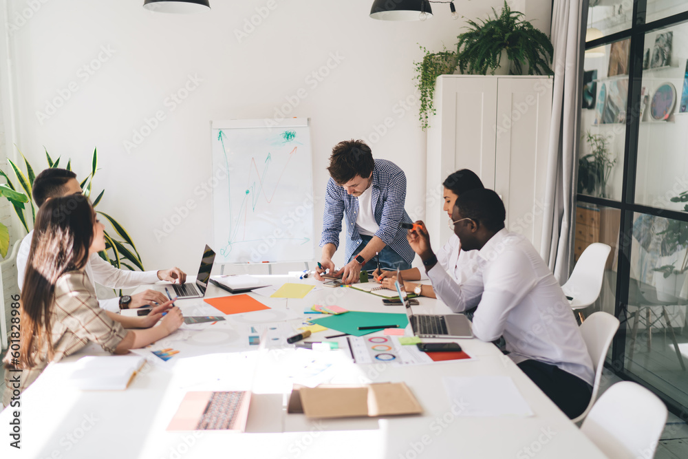 Sticker Group of diverse colleagues working on project in meeting room in office