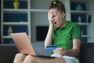 Internet fraud. Nervous sad upset unhappy confused young woman, stressed worried lady having...