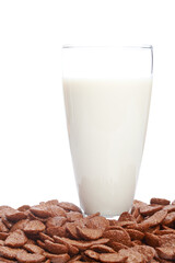 A fresh milk tumbler and chocolate cornflakes on white background. Shallow depth of field