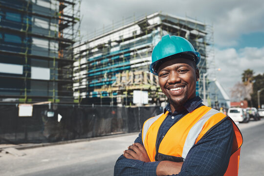 Construction, engineer and happy portrait of a black man outdoor at building site for development and architecture. Male contractor smile for project management, engineering and safety inspection