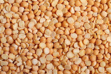 Dry chopped yellow peas. Food background. Macro. Closeup