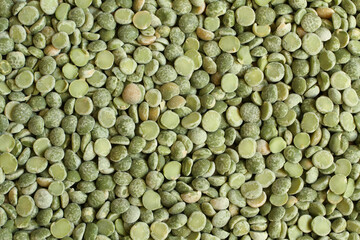 Dry chopped green peas. Food background. Macro.