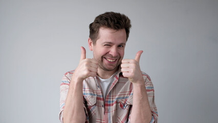 The European young man gives a thumbs up, approving the choice