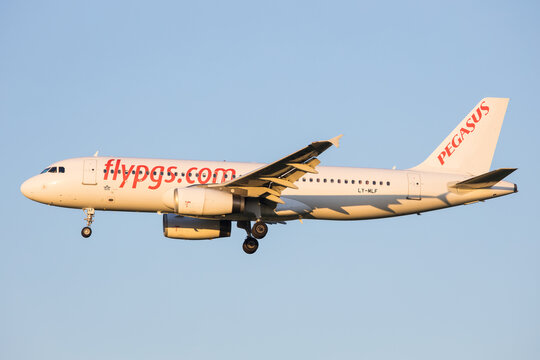 Vienna, Austria - 30 April, 2023: Turkish low cost airline Pegasus, Flypgs landing with Airbus 320 in sunset light