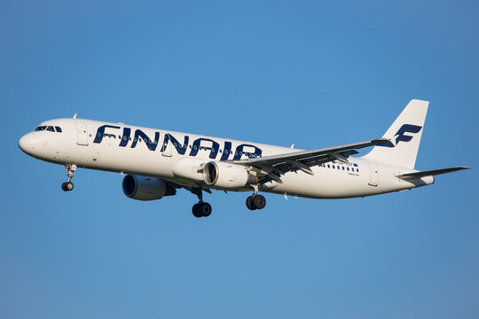 Vienna, Austria - 30 April, 2023: Finnish airline Finnair landing with Airbus A321 aircraft in front of clear blue sky