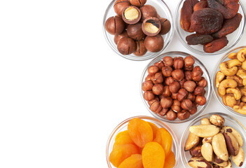 Set of nuts and dried apricots in a bowls