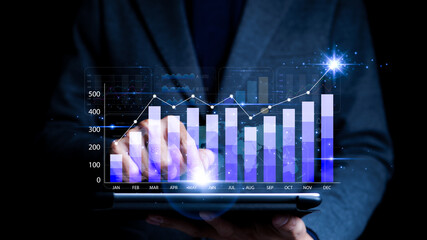 Businessman analyzing business enterprise data management, business analytics with charts, metrics and KPI to improve organizational performance, Marketing, Financial, Analyst, Business growth chart.