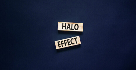 Halo effect and psychological symbol. Concept words Halo effect on beautiful wooden block. Beautiful black table black background. Business psychological and Halo effect concept. Copy space.