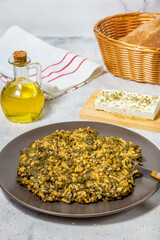 Spanakorizo Greek dish of spinach and rice  in tomato sauce