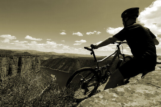 Biker taking a break from the trail, Flaming Gorge, Utah