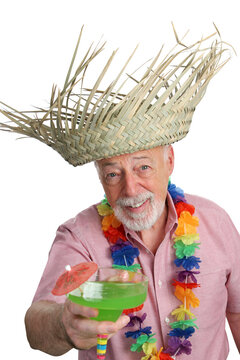 A senior man on a tropical vacation offering you a margarita.