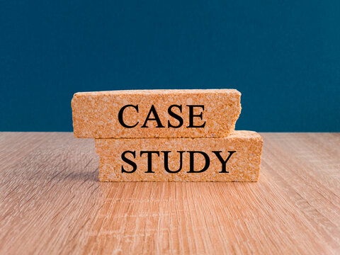 Case stady symbol. Concept words Case stady on brick blocks. Beautiful wooden table dark blue background. Business and Case stady concept.