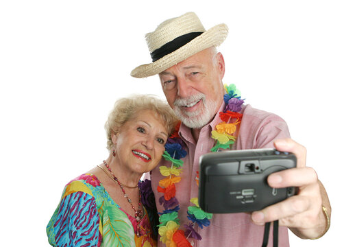 An attractive senior couple taking their picture on vacation.