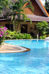 Tropical spa resort with a swimming pool in Phuket, Thailand - travel and tourism.
