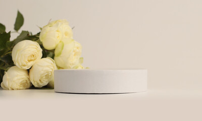 Yellow rose flower bouquet and white podium. Light beige background. Minimal empty display product presentation scene.