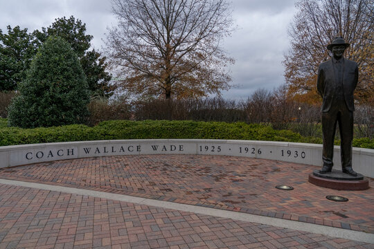 A Statue Of National Championship Winning Football Coach Wallace Wade Outside Of Bryant-Denny Stadium On The Campus Of The University Of Alabama On An Overcast Day.