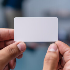 hand holding a business card