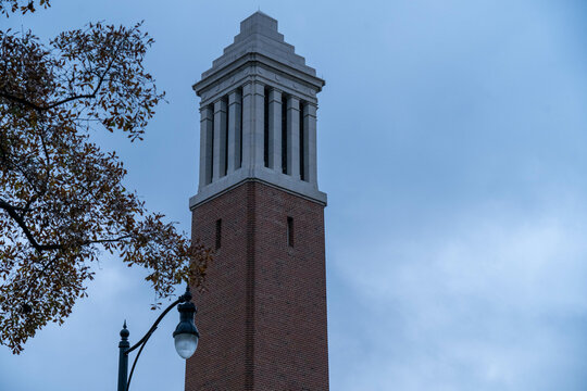 The Iconic Denny chimes stands above the University of Alabama on an overcast day.