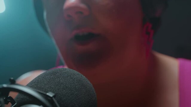 Podcast about body positivity. Chubby fat woman speaks into the microphone, talks about self-acceptance, diet. Tells how to cook delicious healthy food. Concept of diverse beauty and lifestyle
