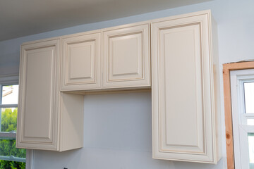 installing new cabinets in modern kitchen