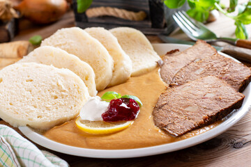 Plate of svickova na smetane, popular traditional Czech meat dish with sirloin steak prepared with...