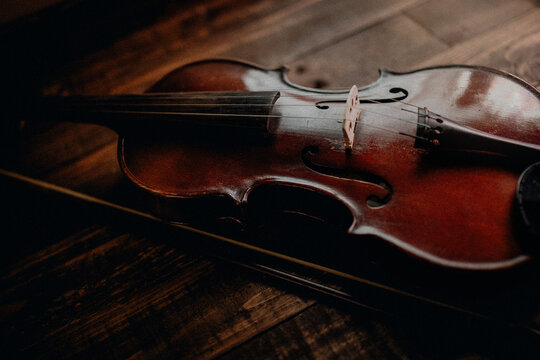 Close-up of a violin on a wooden table