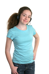 Obraz premium A smiling teen girl in a blank blue t-shirt and listening to headphones. Tee shirt ready for logo.