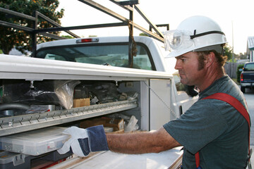 Electrician working from his service truck.  Authentic image.  Model is actual licensed Master...