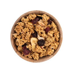 crunchy granola in wooden bowl isolated on white, muesli pile with nuts, cranberry and raisins...