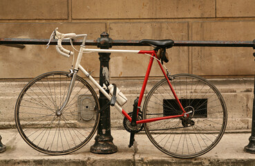 Fototapeta na wymiar Two-wheeled bicycle parked in city street