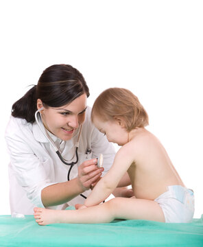 Young pediatrician with baby girl, over white background