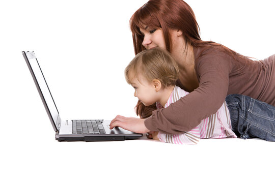 mother and daughter playing on laptop