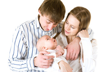 Happy mother and father holding a young baby girl. Isolated on white background.