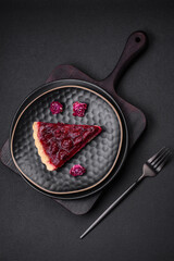 Delicious fragrant sweet pie with cherry berries on a ceramic plate