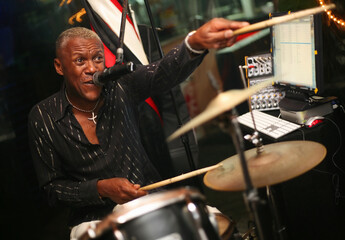 Smiling african musician at an alive concert