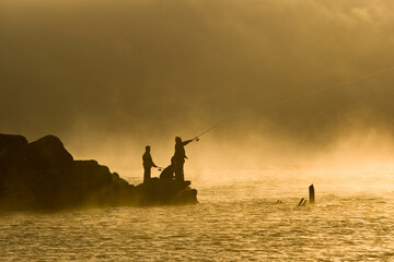 Group of anglers fishing in the mist